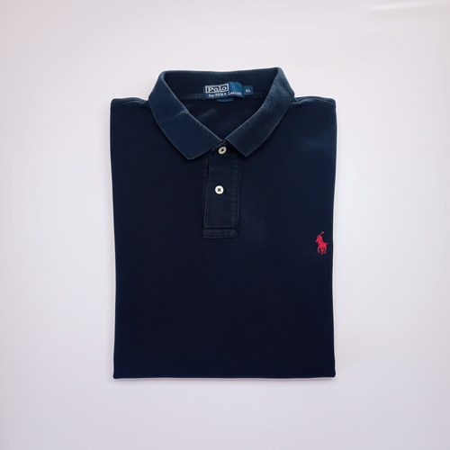 Polo bleu marine XL bien plié fond blanc